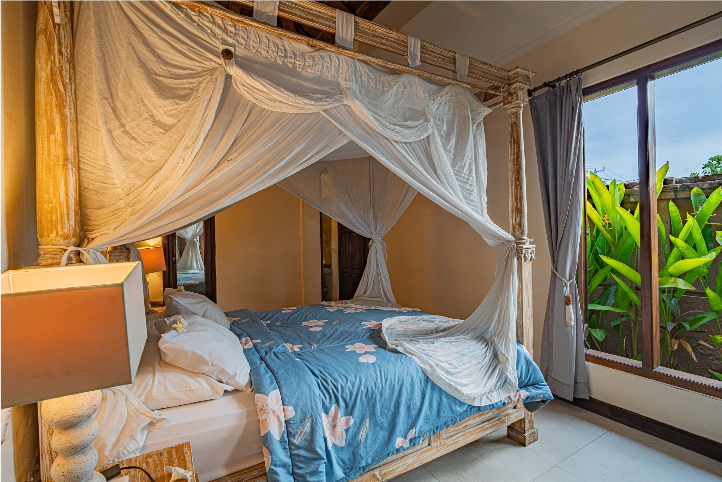 Luxury king bedroom with Balinese mosquito net canopy